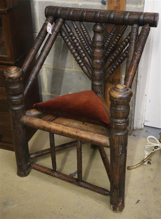 A 19th century turners chair, with triangular seat and ball-turned spars to back